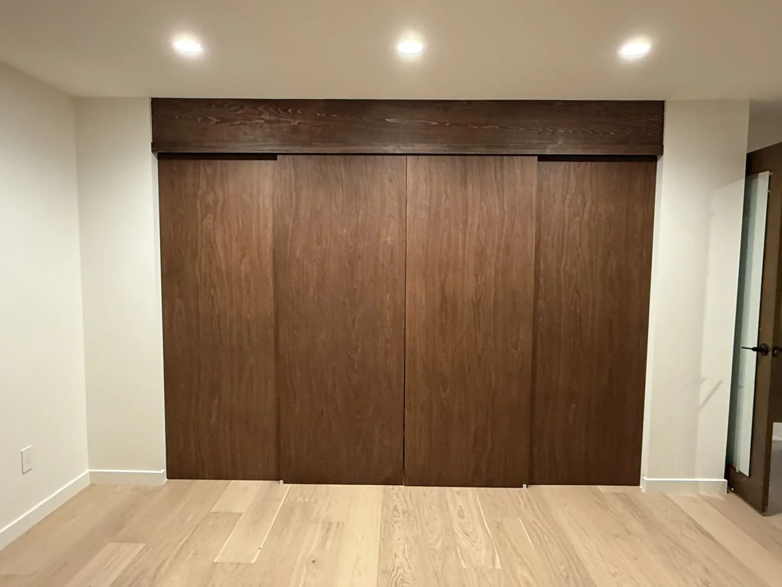 Custom wood closet in the Bellevue primary bedroom