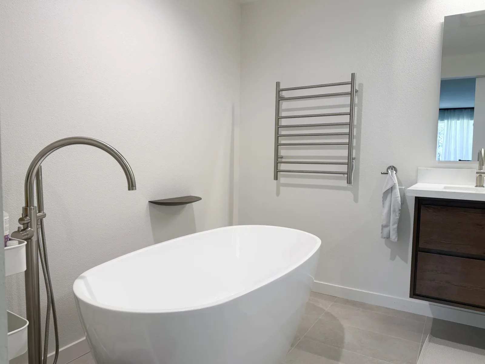 Freestanding soaking tub in the Bellevue primary bathroom