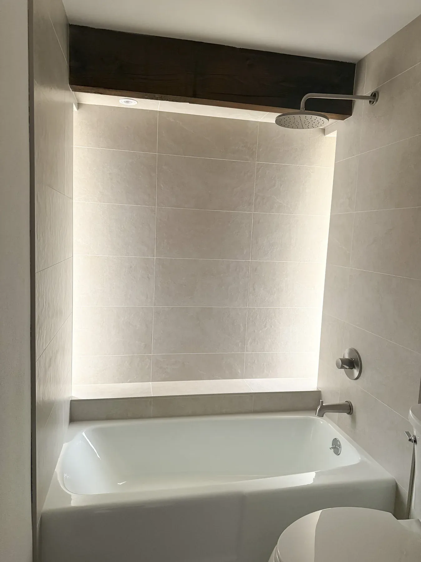Finished Bellevue guest bathroom recessed niche