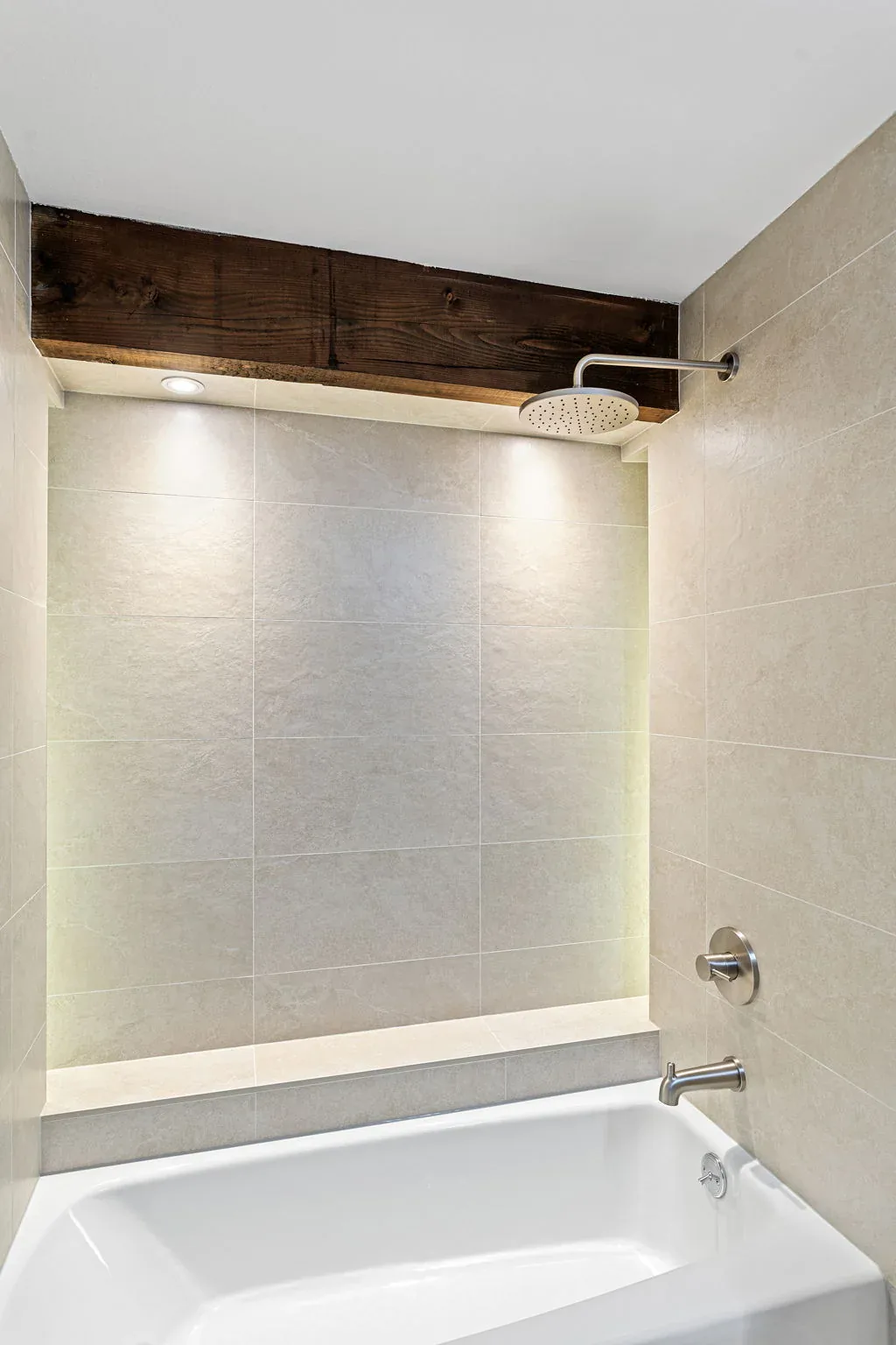 Finished guest bathroom tub and shower after the Bellevue remodel