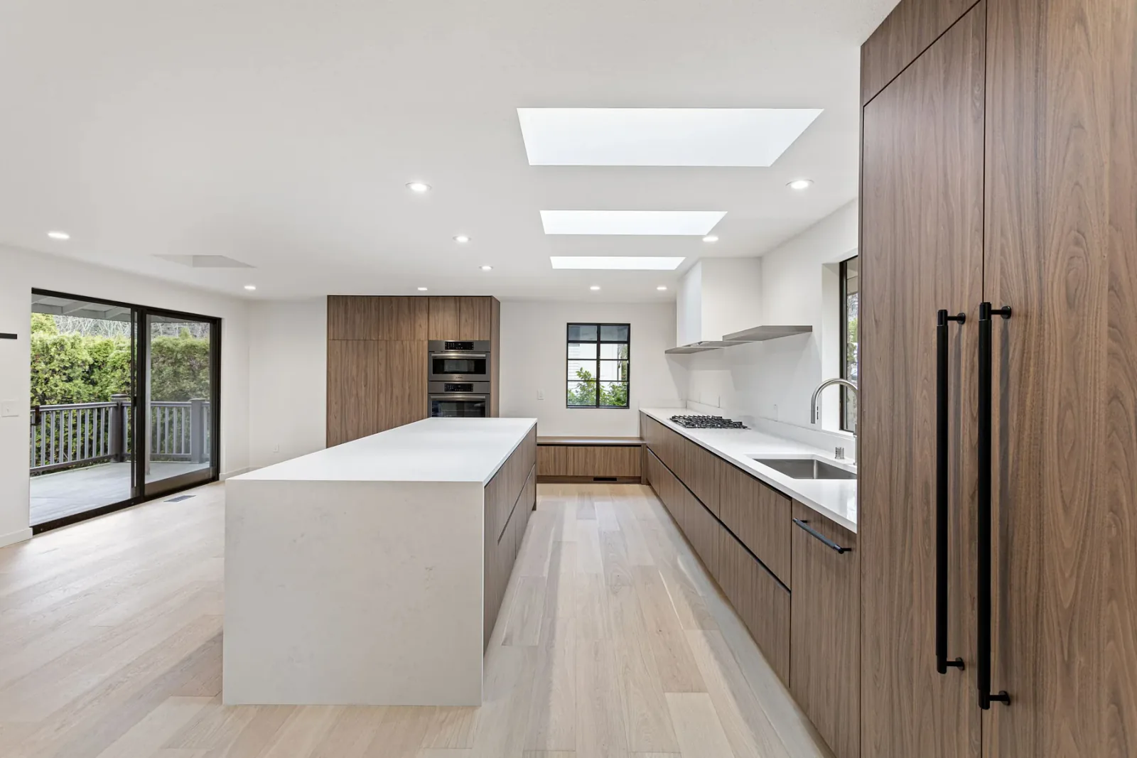 Finished Bellevue kitchen island beneath three skylights