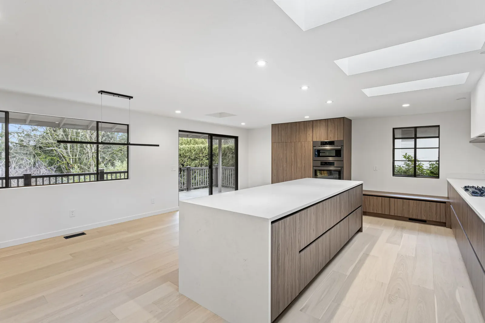 Finished Bellevue open-concept kitchen beneath new skylights