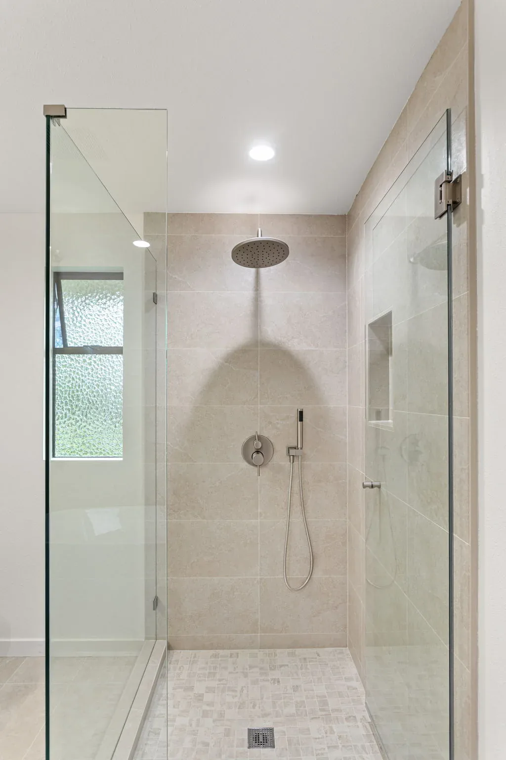 Walk-in shower fixture detail in the Bellevue primary bathroom