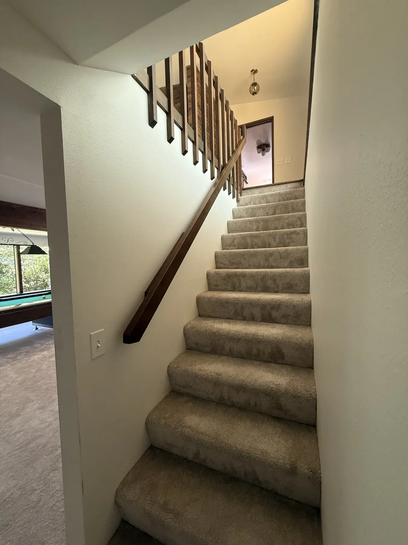 Old Bellevue carpeted staircase before remodeling