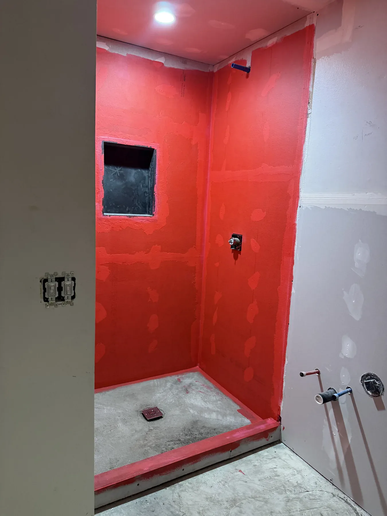 Lower-floor shower waterproofing during the Bellevue remodel
