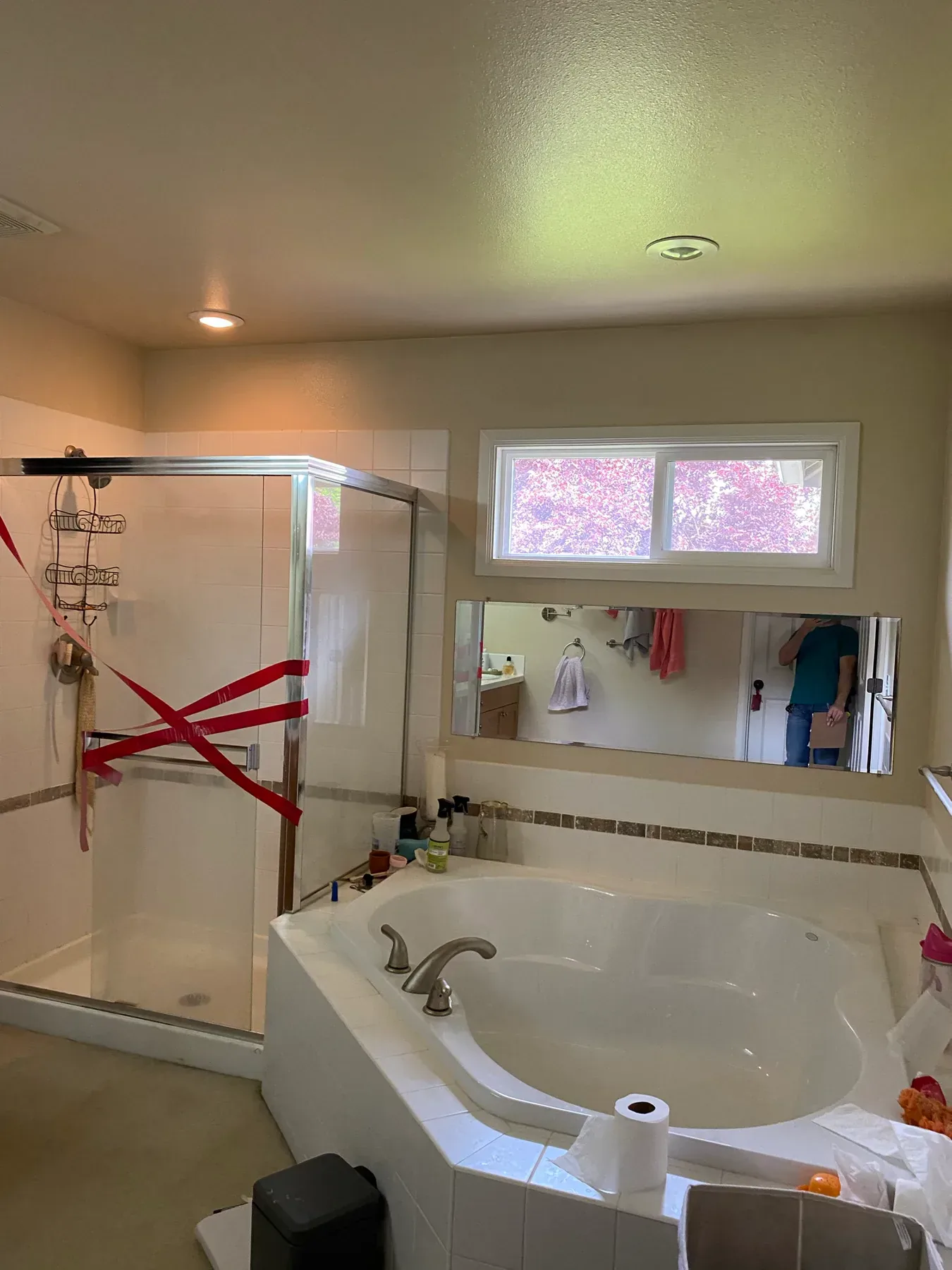 Original corner tub and taped glass shower enclosure in Issaquah, WA