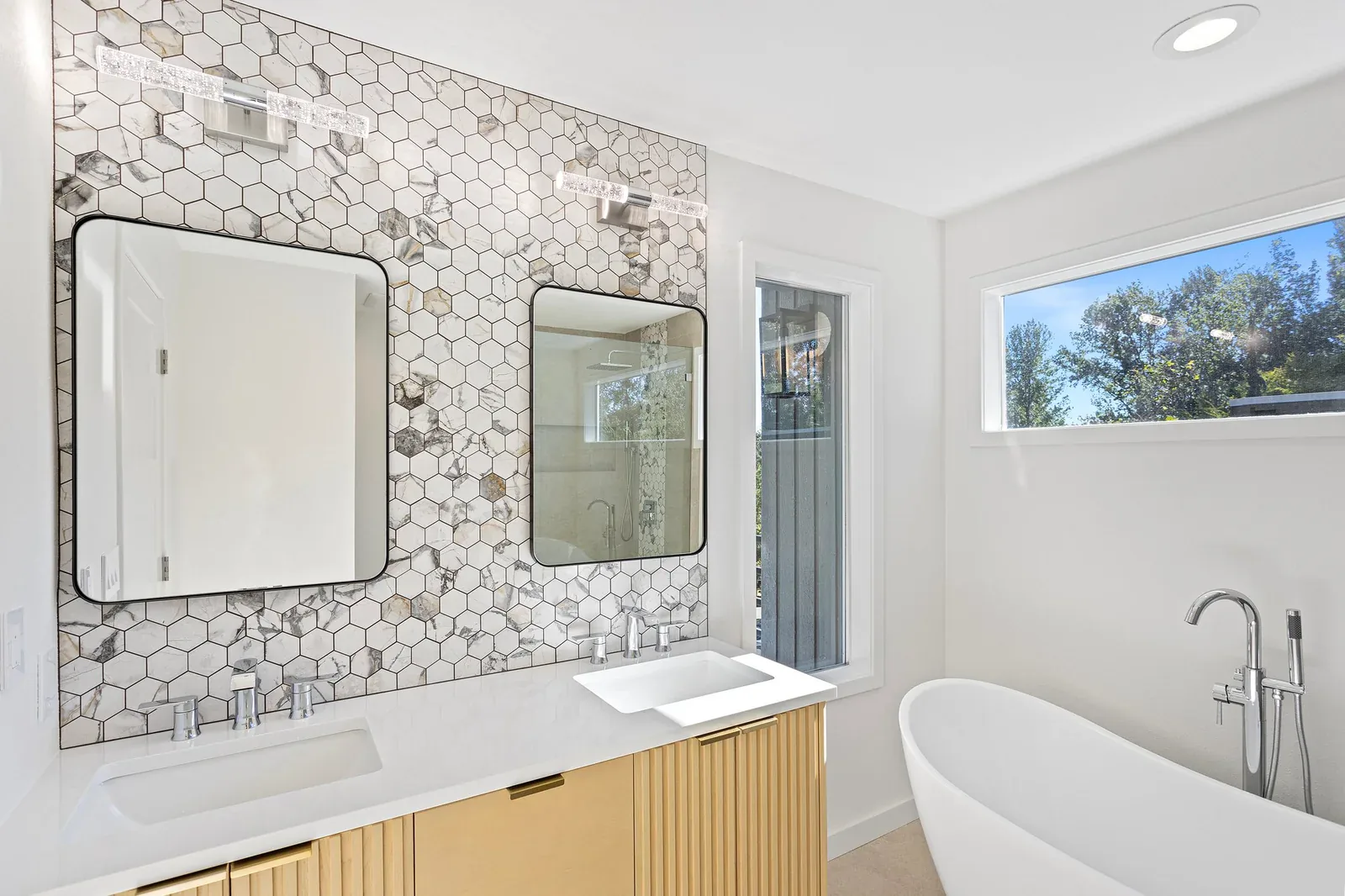 Hexagon mosaic accent wall in the completed Primary Bathroom