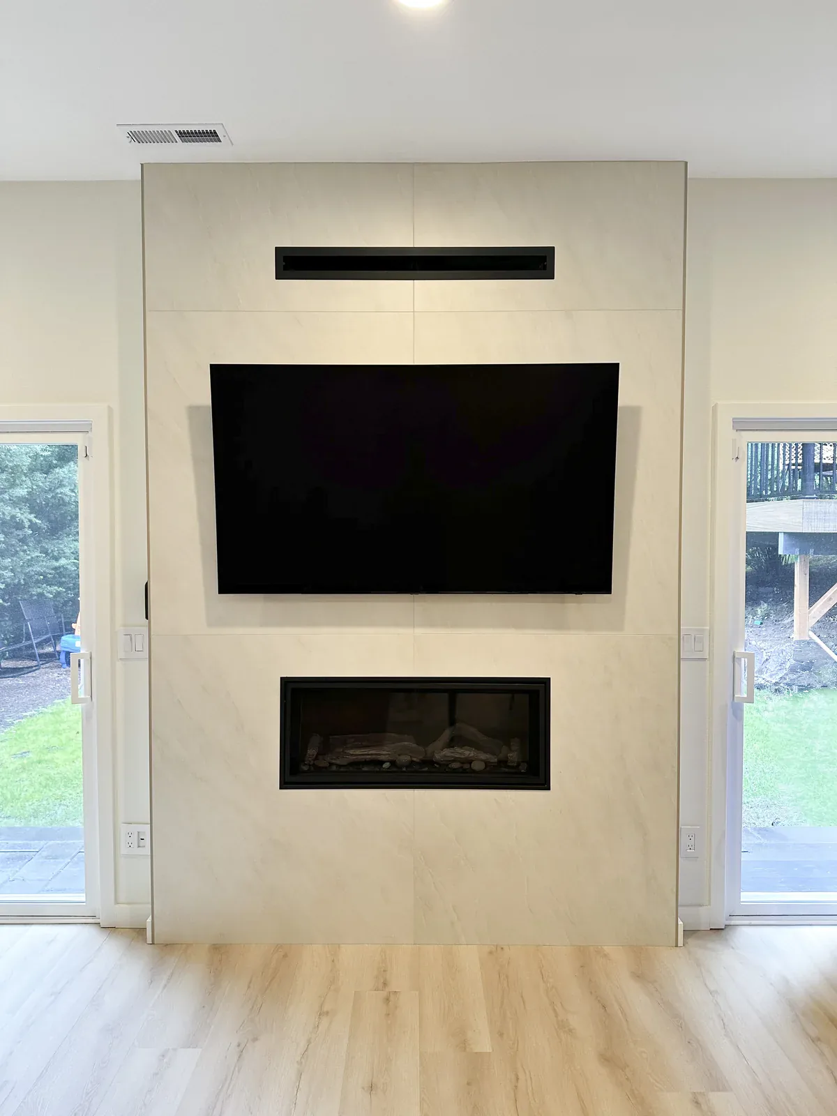 Completed lower-floor gas fireplace in the Kirkland whole home remodel