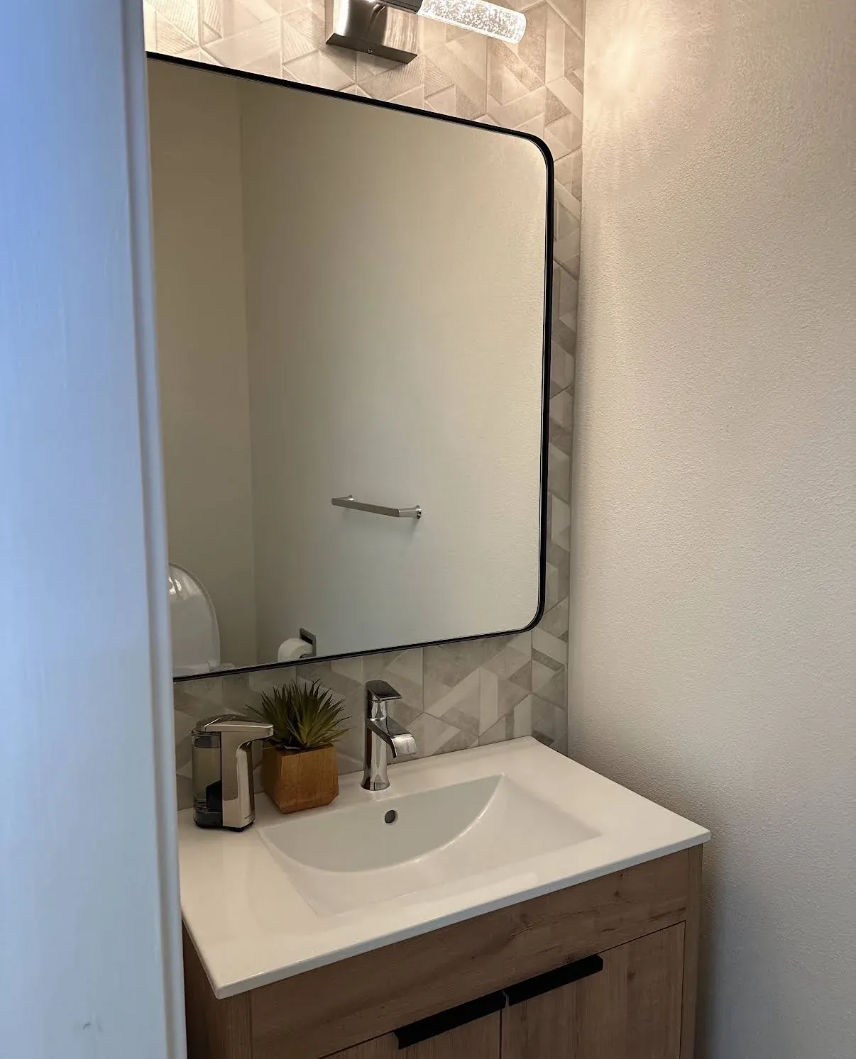 Modern powder room in the Kirkland whole home remodel