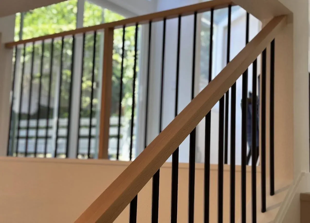 Wood handrail and metal balusters after the Kirkland remodel