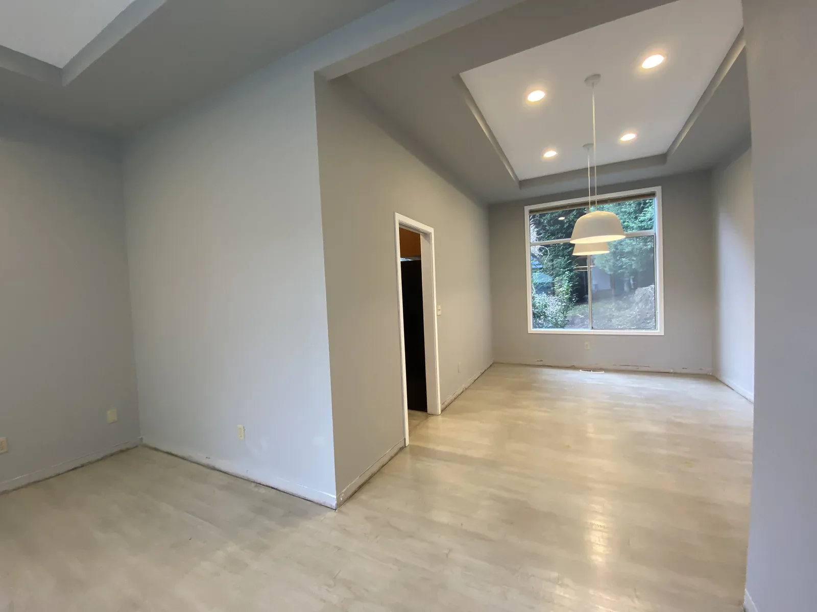 Before: enclosed great room before the kitchen relocation in the Kirkland full home remodel