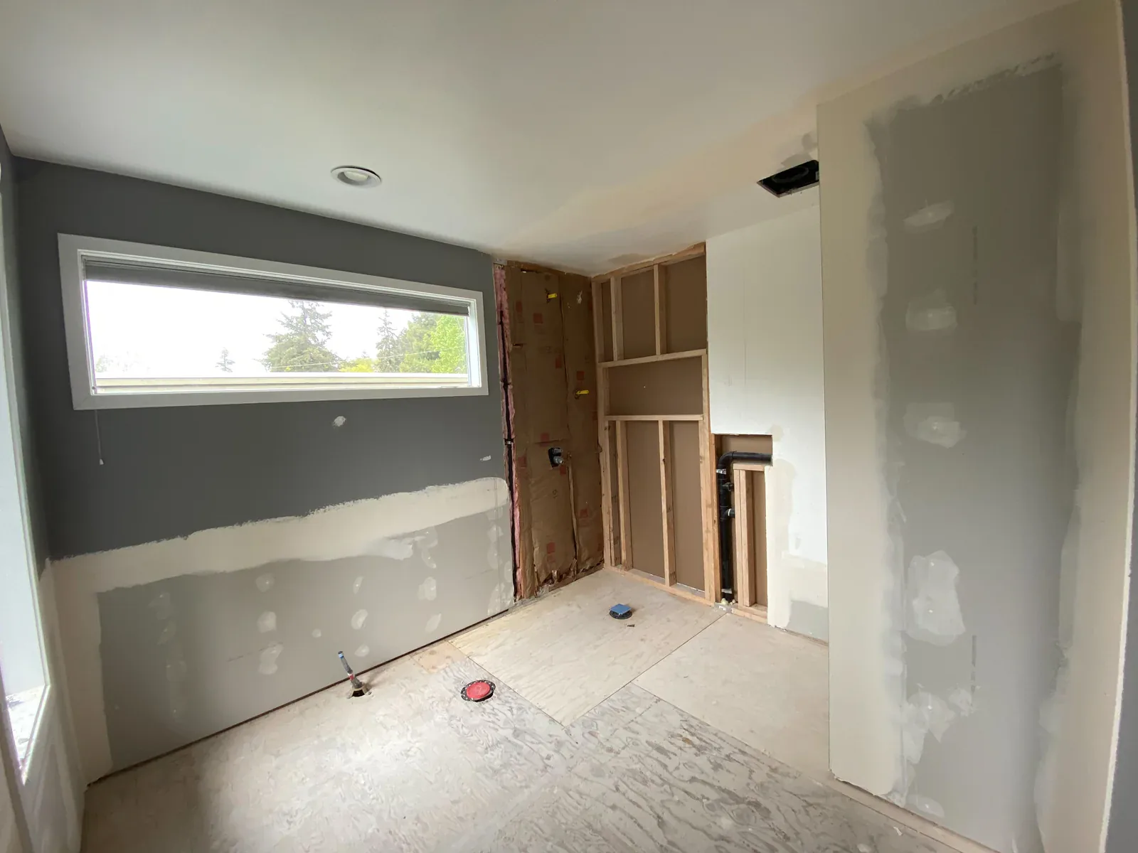Primary bathroom demolition and mechanical preparation during the Kirkland remodel