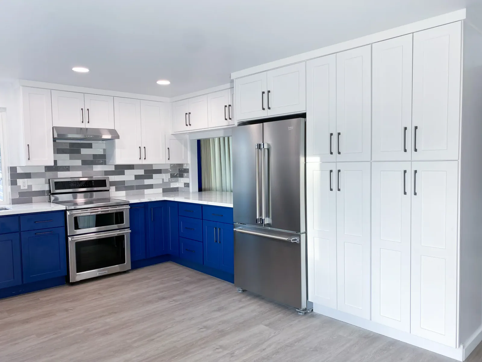 Completed Kirkland kitchen with blue and white cabinetry