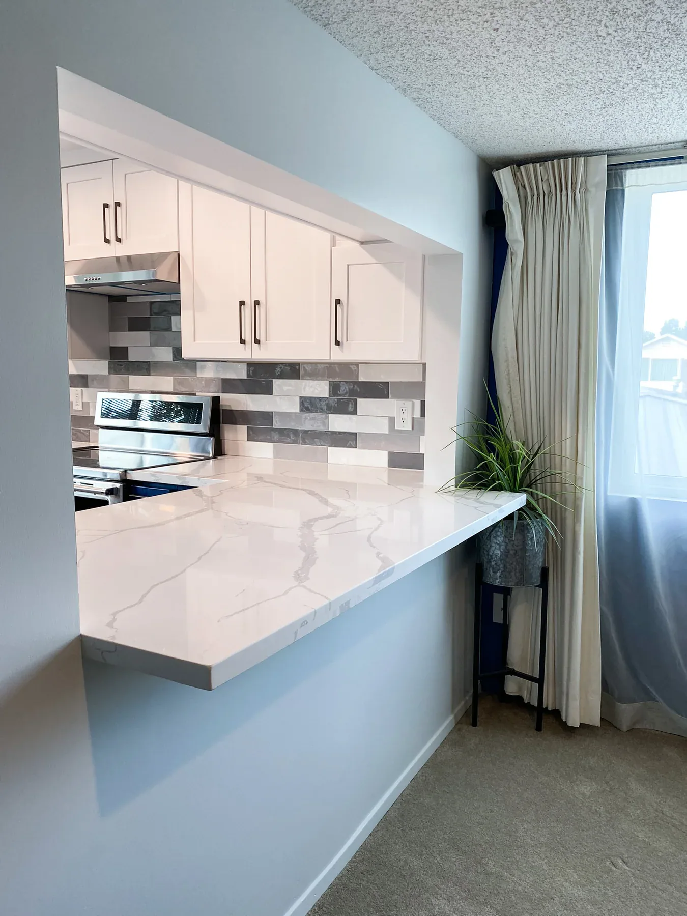 Countertop and pass-through detail in the finished kitchen