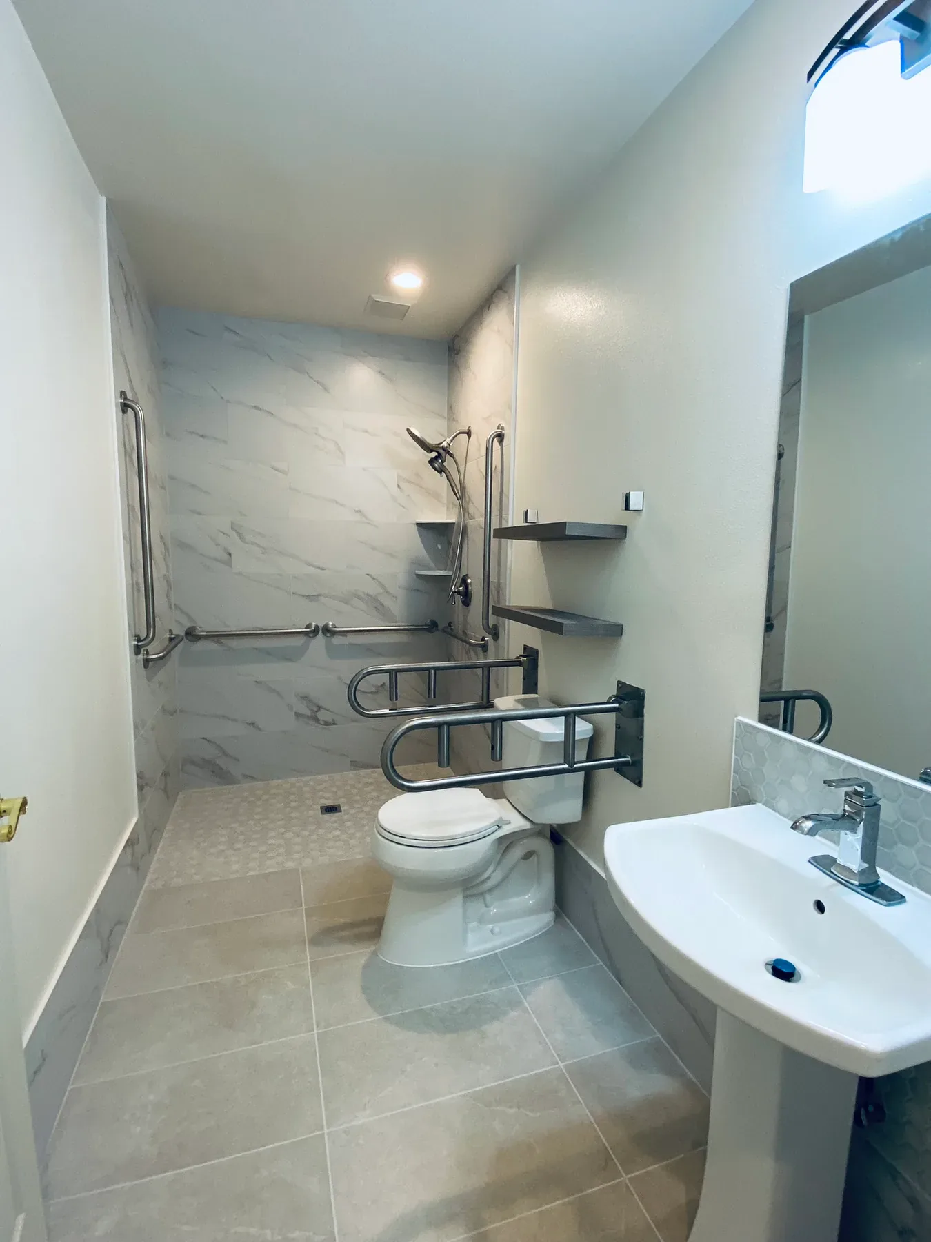 Finished Sammamish wheelchair-accessible bathroom with roll-in shower and grab bars