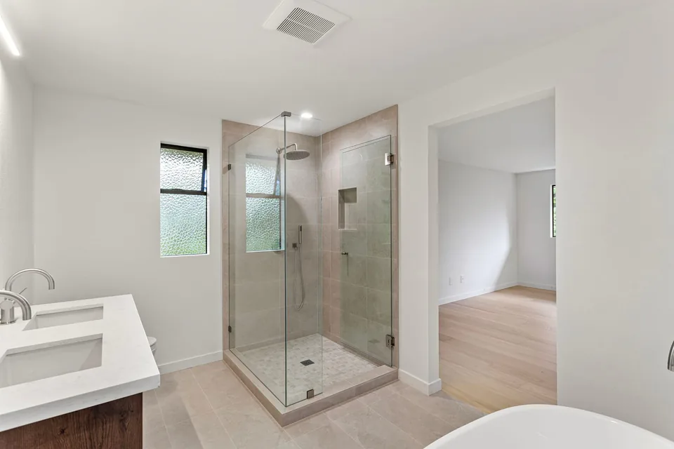 Modern bathroom shower with updated finishes after remodel