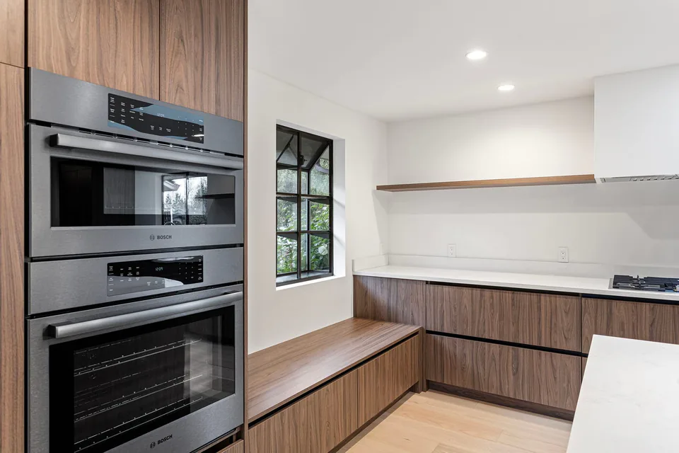 Remodeled kitchen with custom white cabinetry